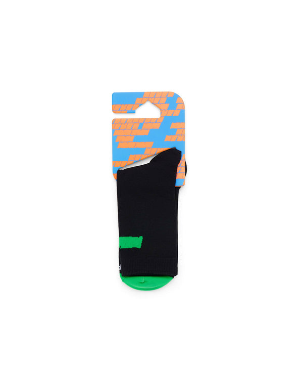 Black Race Sock folded neatly displaying signature intarsia Never branding