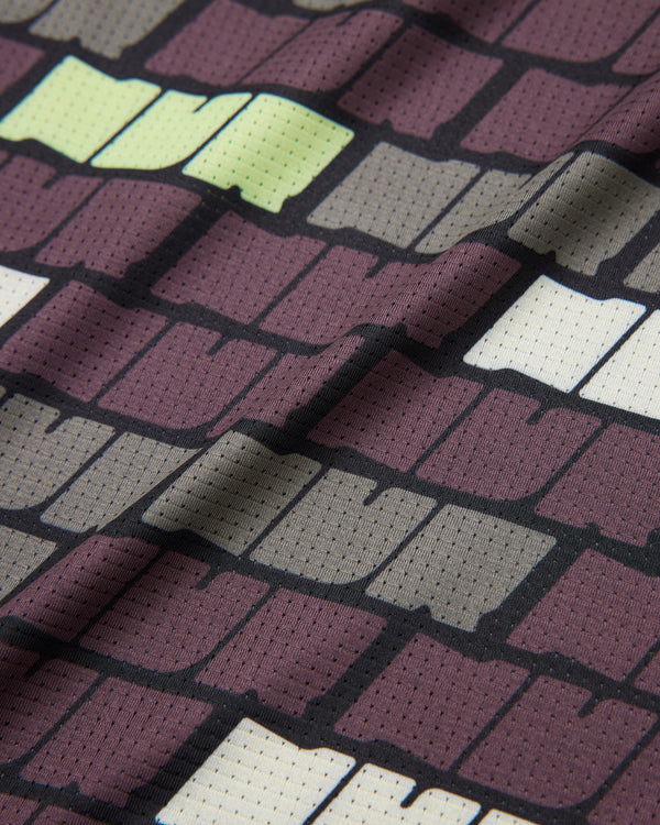 Close-up of technical mesh fabric on Bricks Singlet – moisture-wicking running material