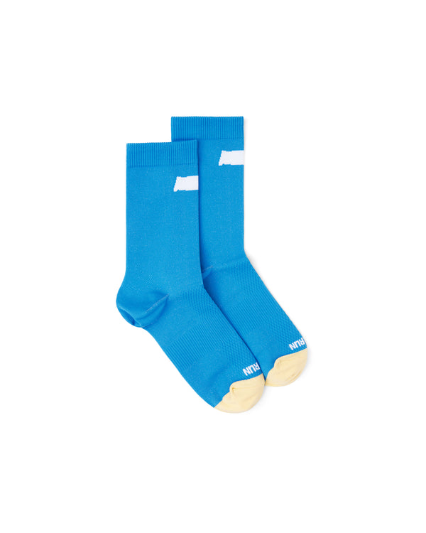 Pair of Blue Race Socks laid flat showing ribbed cuff and breathable knit fabric